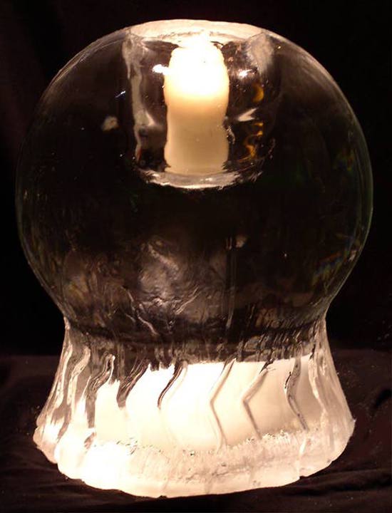 [IMAGE - An ice globe that holds candles.]
