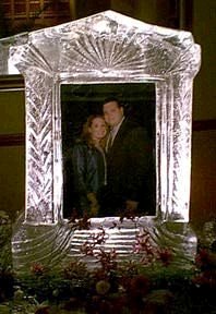 Click on image to view full size [IMAGE - Bride and Groom framed in ice]